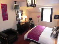 Leather Bed and chair in Main Bedroom 